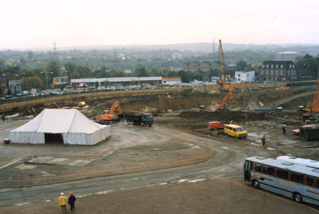 The buses wait to take the guests to the hotel. | JLP Archive Collection