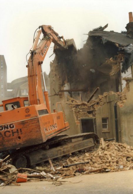 Demolition begins on the cottages. | JLP Archive Collection.