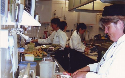 Preparing dishes in food preparation area kitchen Robert Sayle