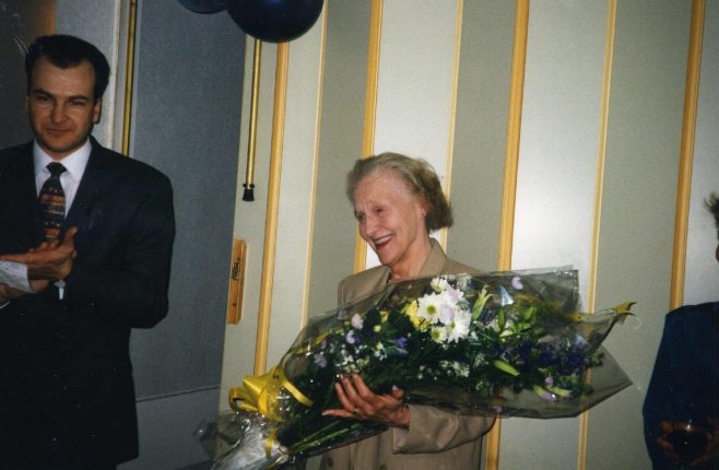 Eilean Starns with her bouquet, presented by Simon Fowler on the occasion of her retirement from Robert Sayle.