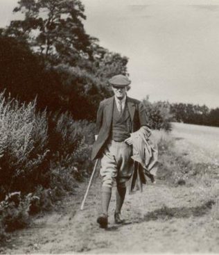 John Spedan Lewis walking across fields at Leckford August, 1941 
Ref-4408/p