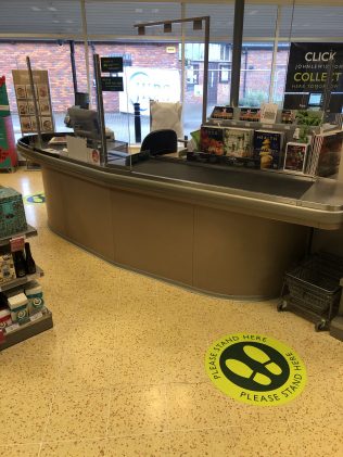 Safe distance reminder stickers on the floor and perspex screens at the checkout to enable both our customers and cashiers to interact safely. | Jake Townsend - ATM Buckingham