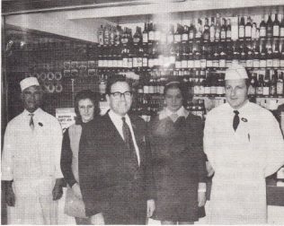 Branch Manager, Ted Warrington is in the centre of the picture; with him from left are Eric Woods, Manager Provisions and Delicatessen; Mrs Thelma Ellis - Assistant Manager Non Food, Miss Sylvia Duffy- Assistant, and Mr John Moss - Meat Manager