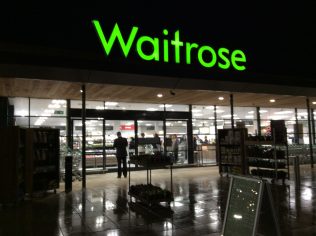 A night time view of Little Waitrose Faringdon customer entrance | Store Planning Photo Library